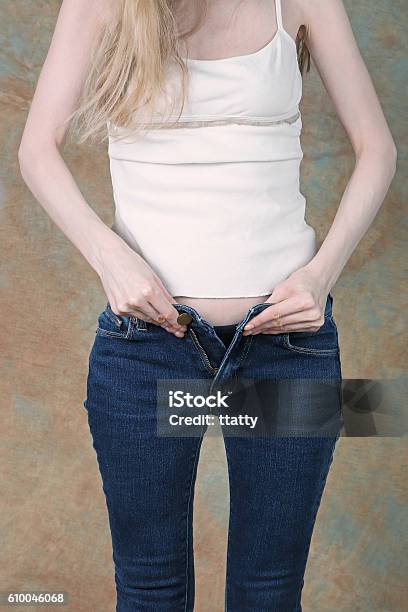 Zipping Up Tight Jeans Stock Photo - Download Image Now - Narrow, Women, Adult