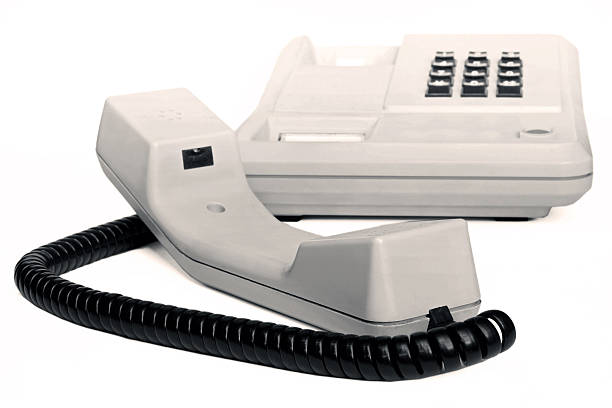 istock Old simple office desk phone sepia 610046200