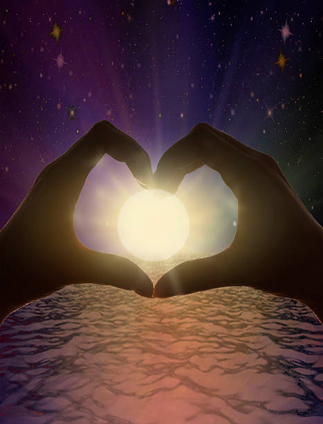 istock Heart shape with hands against the sun at dust 610046834
