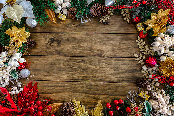 istock Christmas Gifts decor making a frame on a wood background 610047012