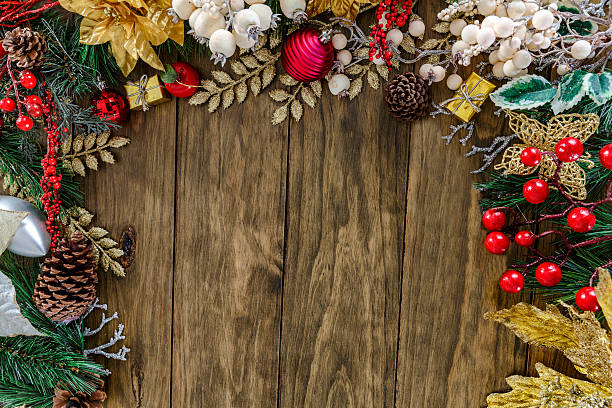 istock Christmas Gifts decor making a partial frame on wood background 610047834