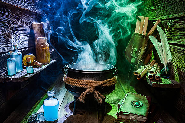 istock Vintage witch pot with blue and green smoke for Halloween 610048734