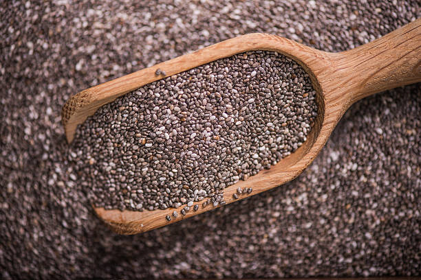istock Heathy Chia seeds with wooden spoon 610048856