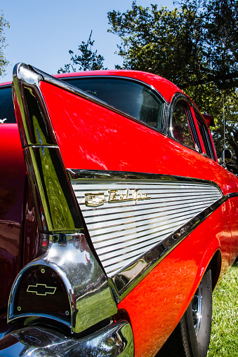 Paso Robles, California, United States - September 5, 2015: Right rear view of the iconic tail fin on a bright red 1957 Chevrolet Bel Air two door sedan being displayed at the annual Golden State Classics car show in Paso Robles, California