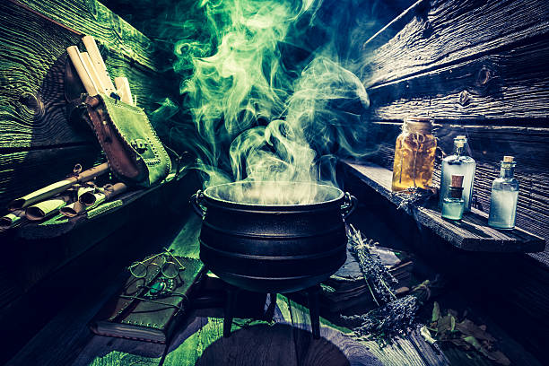 istock Magical witcher cauldron with scrolls, books and potions for Halloween 610050740