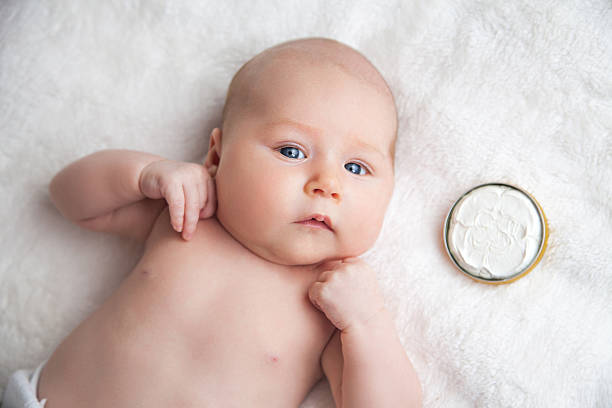 healthy feeling skin makes a happy baby - control room stockfoto's en -beelden