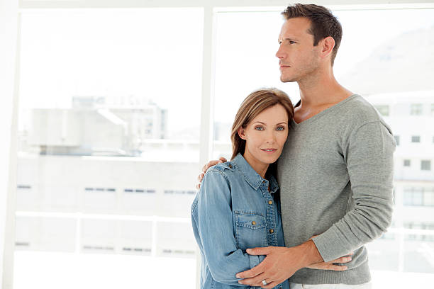 istock Mid-adult couple hugging 610114782