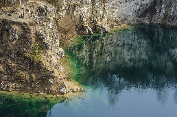istock Beautiful view on azure lake and cliffed coast 610115034