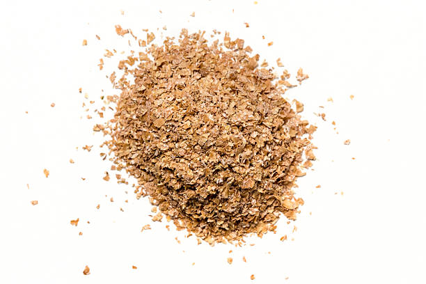 istock Pile of wheat bran isolated on white background 610117178