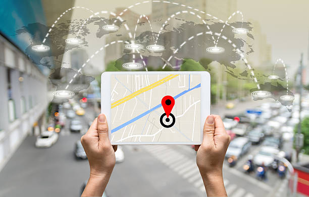 istock female hands holding a tablet showing part of navigator map 610119450