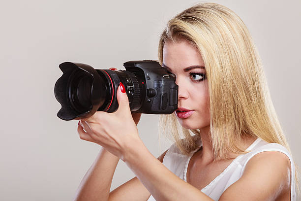 istock Beautiful woman with camera. 610119650