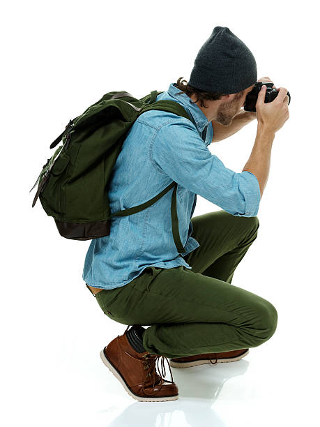 istock Photographer in action with camera 610119770