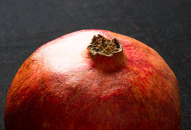 Pomegranate on black background