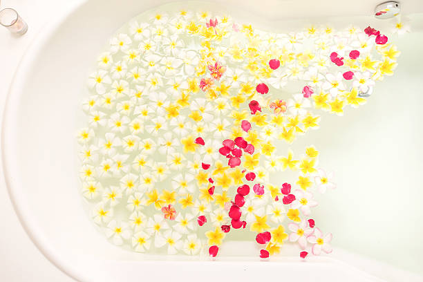 istock Spa bath full of frangipani flowers for relaxation 610120672