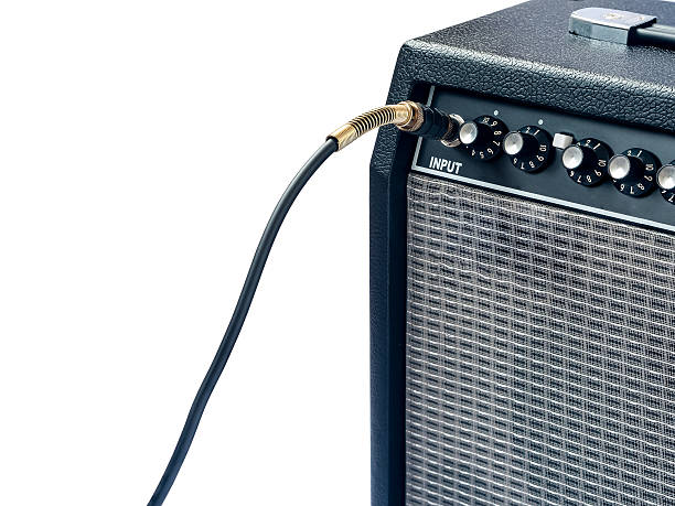 istock guitar amplifier with jack cable isolated on white background 610121988