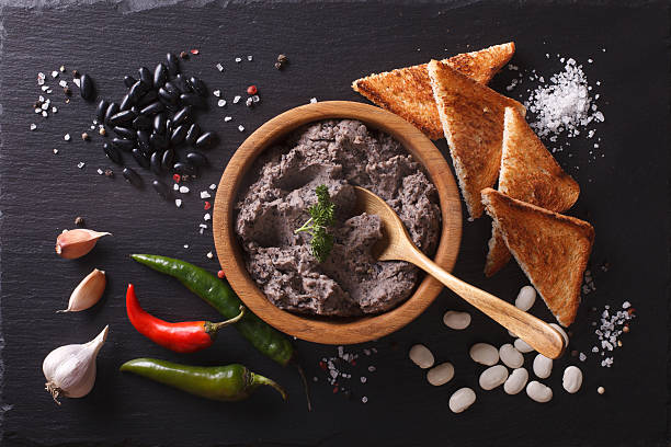 mexican cuisine: pate of black beans on the table. horizontal - asian cuisine close up garlic vegetable imagens e fotografias de stock