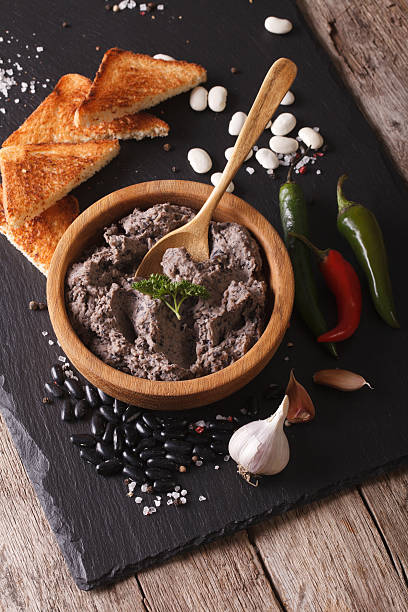 istock Mexican cuisine: Frijoles refritos with ingredients close-up 610124382