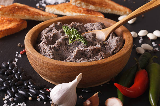istock Frijoles refritos with ingredients close-up. Horizontal 610124544