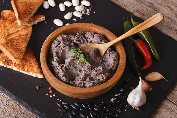 istock Mexican cuisine: Frijoles refritos with ingredients close-up 610124908
