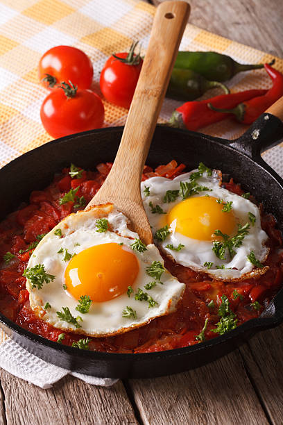 istock Traditional Mexican breakfast fried egg with salsa closeup 610126258