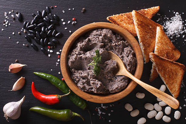 istock Mexican cuisine: pate of black beans close-up. horizontal 610127728