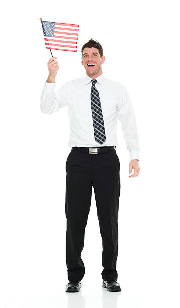 istock Cheerful businessman holding American flag 610127754