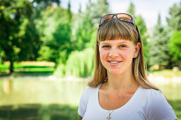 istock Attractive young lady in park enjoying in the nature 610128224