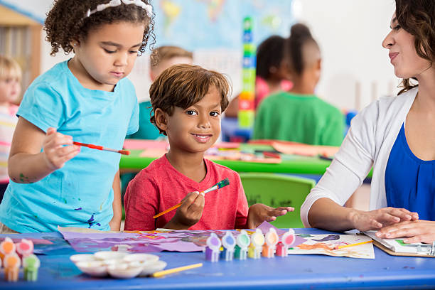 istock Adorable Hispanic boy at daycare and playing with paints 610128726