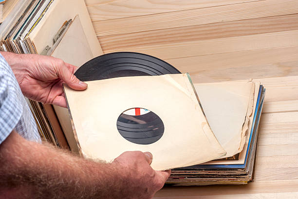 istock Browsing through vinyl records collection. Music background. Copy space 610129046