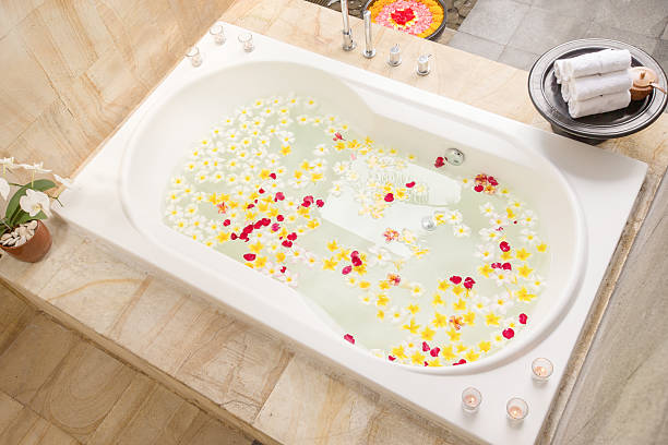 istock Spa bath full of frangipani flowers for relaxation 610129130