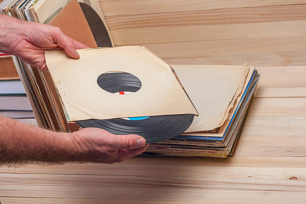 istock Browsing through vinyl records collection. Music background. Copy space 610129476