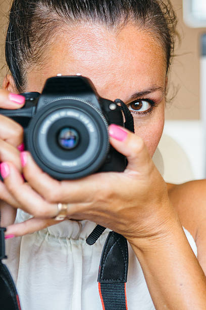 istock Adult woman with camera 610130110