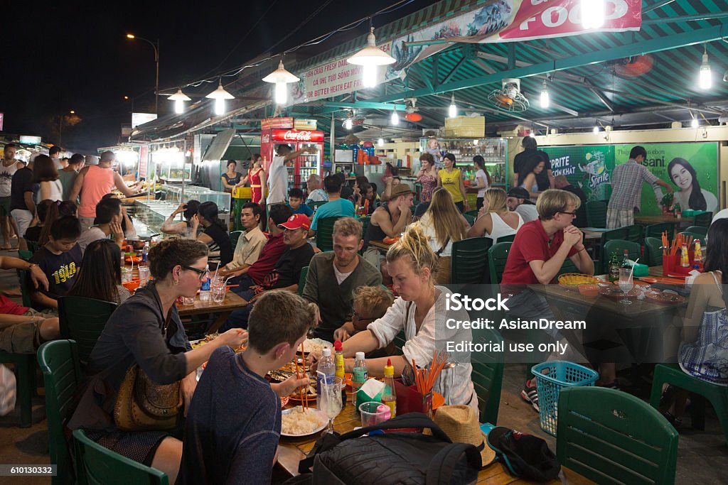 Phu Quoc night market Phu Quoc, Vietnam - January 27, 2016: Many groups of tourists eat mostly fresh seafood in the Duong Dong night market in Phu Quoc island in south Vietnam. Crowded Stock Photo