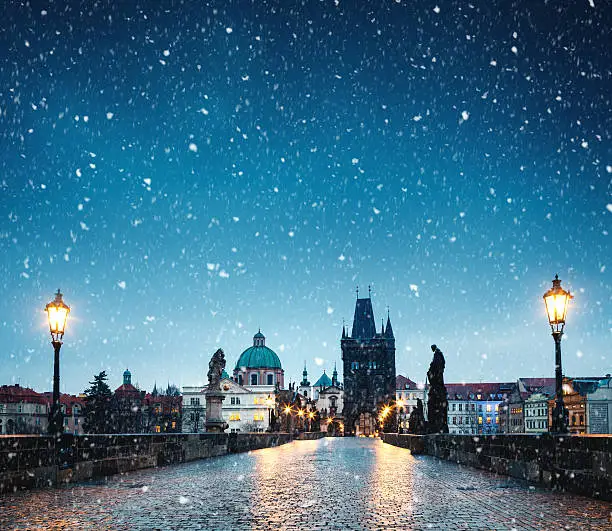 Charles Bridge in Prague on a snowy Christmas morning.