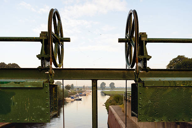 istock Part of an ancient lock near a small marina 610131122