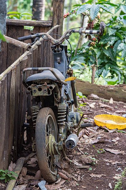 istock old abandoned motorbike in the forest 610132204