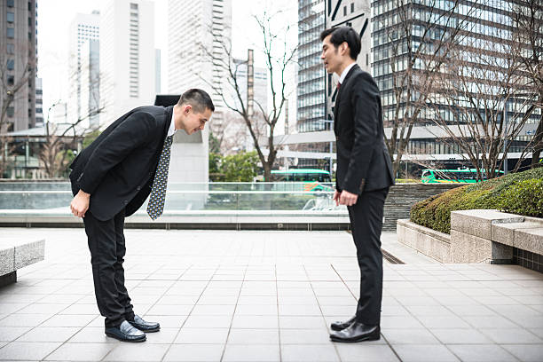 istock japanese Business greetings together on the downtown 610132306