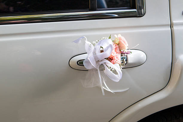 istock Vintage Wedding Car Decorated with Flowers 610132492