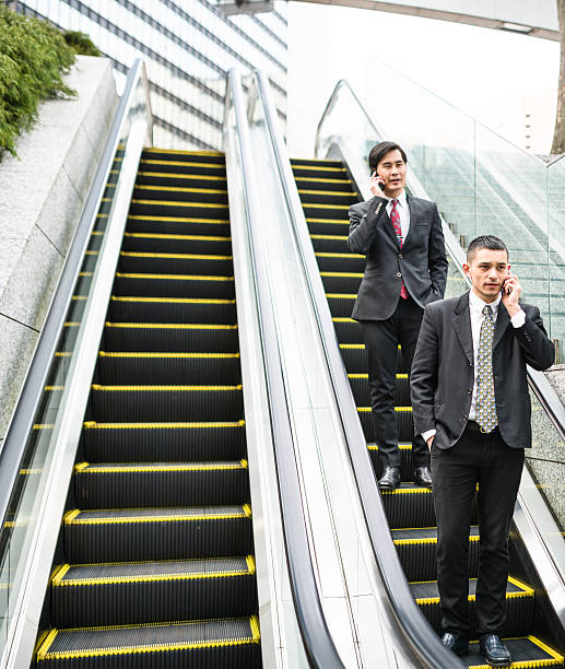 istock japanese Business on the escalator 610132668