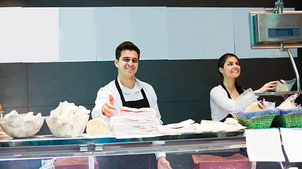 istock Butchers offering salo and meat 610134058