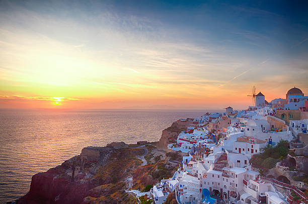 istock windmill of Oia at sunset, Santorini 610136532