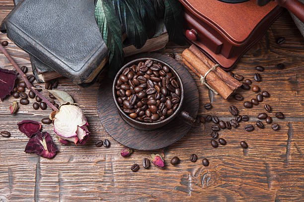 istock Cup of coffee, dry rose and grinder 610137138
