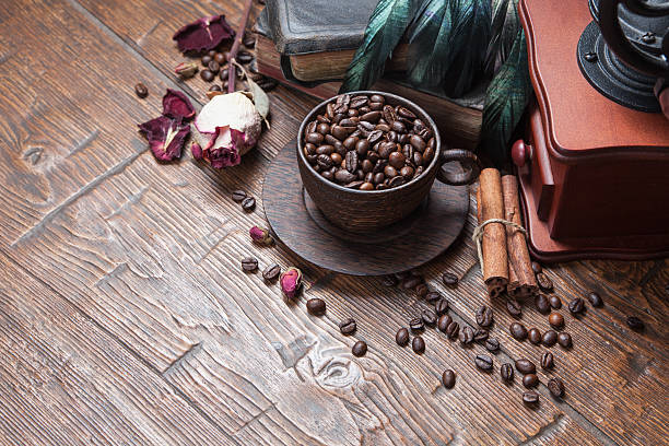 istock Cup of coffee, dry rose and grinder 610137426