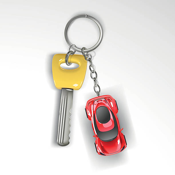 istock Keyring with yellow key and red sport car 610137544