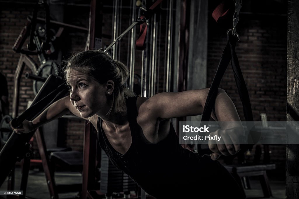 woman doing exercises in the gym close up woman doing exercises in the gym. Fitness and healthy lifestyle concept. Teenage Girls Stock Photo