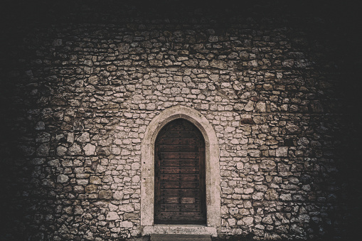 Old wooden door on stone house in Gordes. Provence, France.