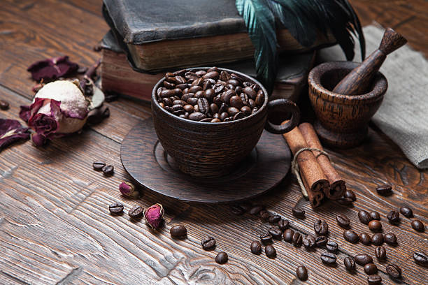 istock Cup of coffee, dry rose and grinder 610137860