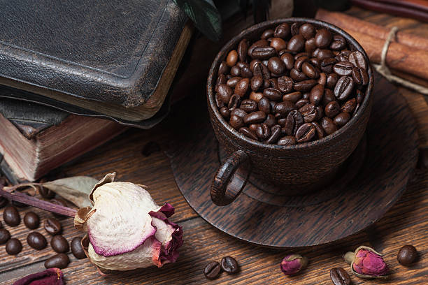 istock Cup of coffee, dry rose and grinder 610138520
