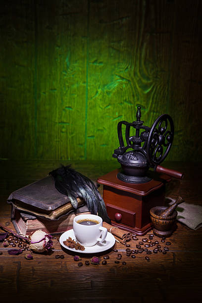 istock Cup of coffee, dry rose and grinder 610139888