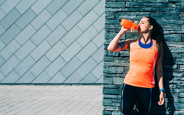 istock Sports Woman Drinking Water 610140714